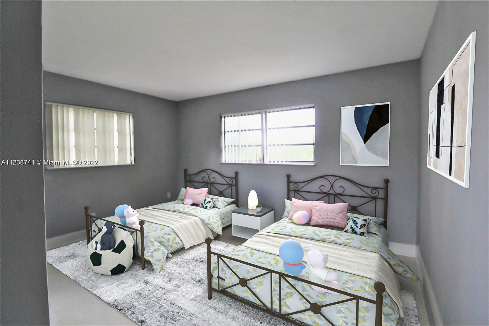 5261 Southwest 9th Street Plantation, FL 33317 - Photo 8 of 27 a bedroom with bed and a window