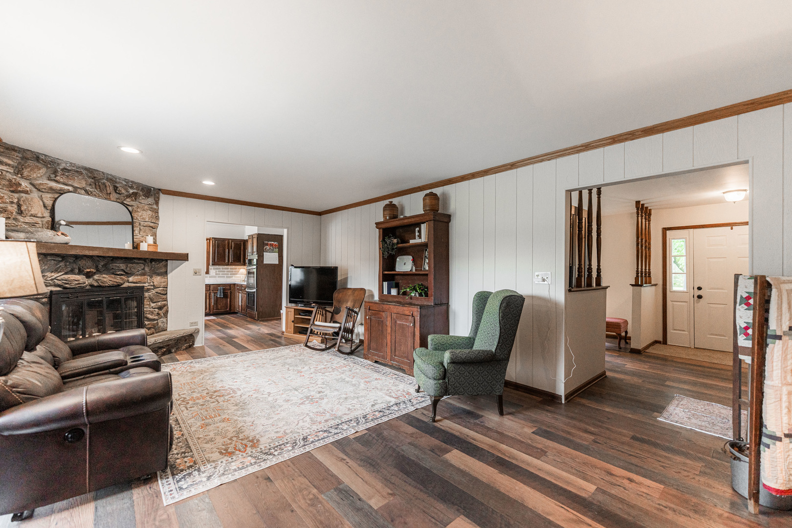 17751 Scott Road Hinckley, IL 60520 - Photo 18 of 72 a living room with furniture a fireplace and a table