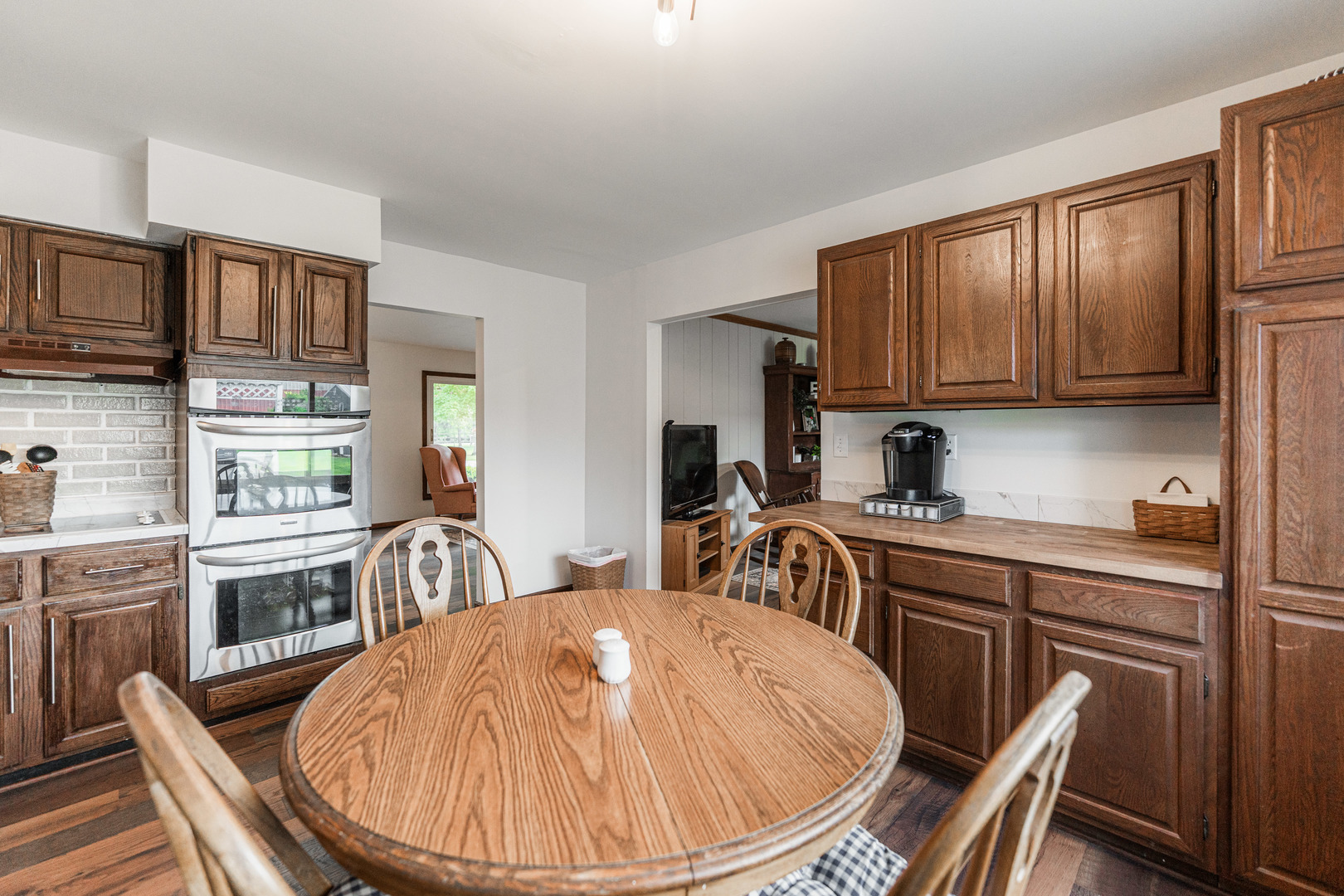 17751 Scott Road Hinckley, IL 60520 - Photo 23 of 72 a kitchen with a table chairs stove and cabinets