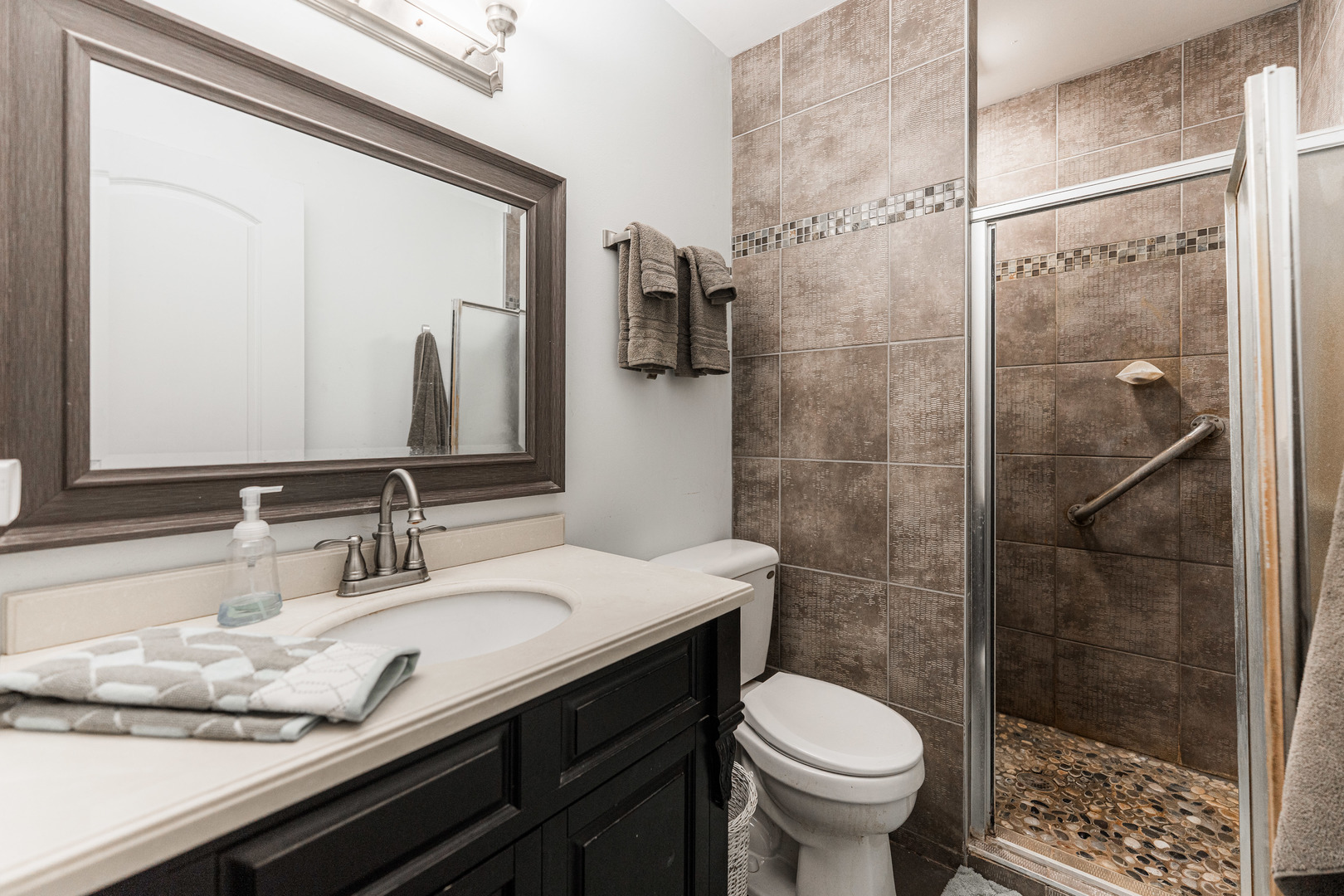 17751 Scott Road Hinckley, IL 60520 - Photo 26 of 72 a bathroom with a granite countertop toilet sink and shower
