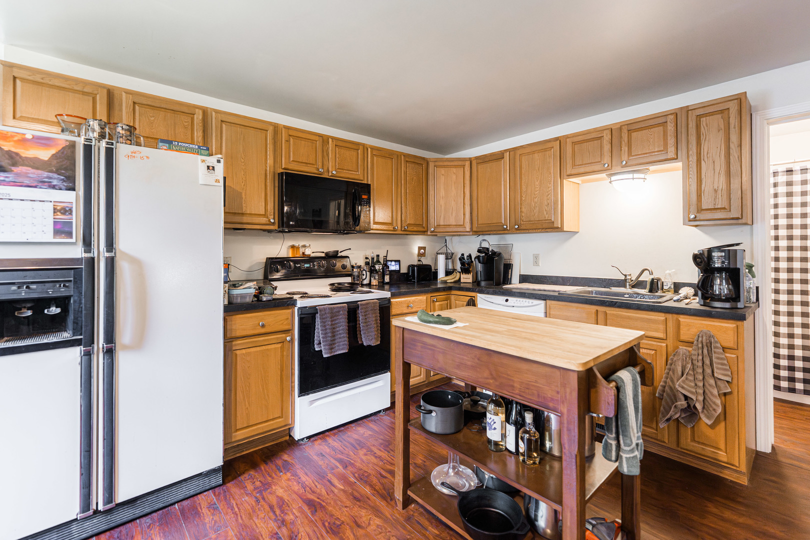 17751 Scott Road Hinckley, IL 60520 - Photo 48 of 72 a kitchen with stainless steel appliances granite countertop a stove a sink a refrigerator and a refrigerator