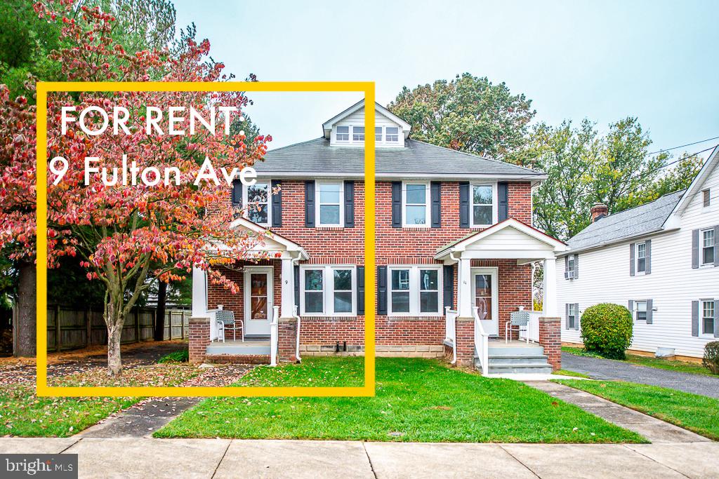 9 Fulton Avenue Walkersville, MD 21793 - Photo 1 of 28 a front view of a house with a yard table and chairs