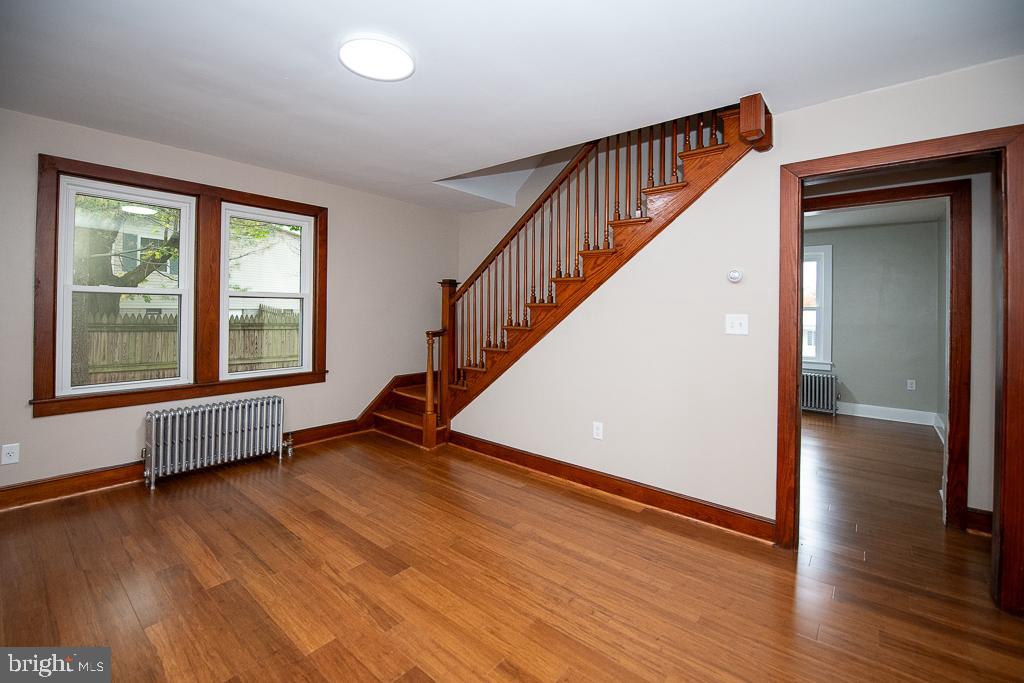 9 Fulton Avenue Walkersville, MD 21793 - Photo 11 of 28 a view of an empty room with wooden floor and windows