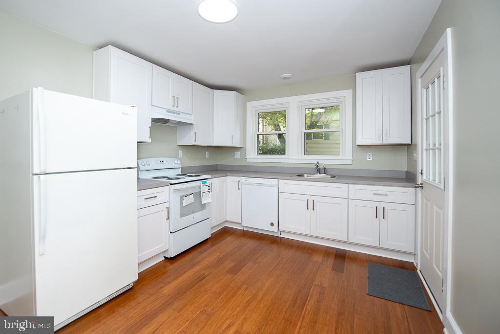 9 Fulton Avenue Walkersville, MD 21793 - Photo 15 of 28 a kitchen with white cabinets white appliances and sink