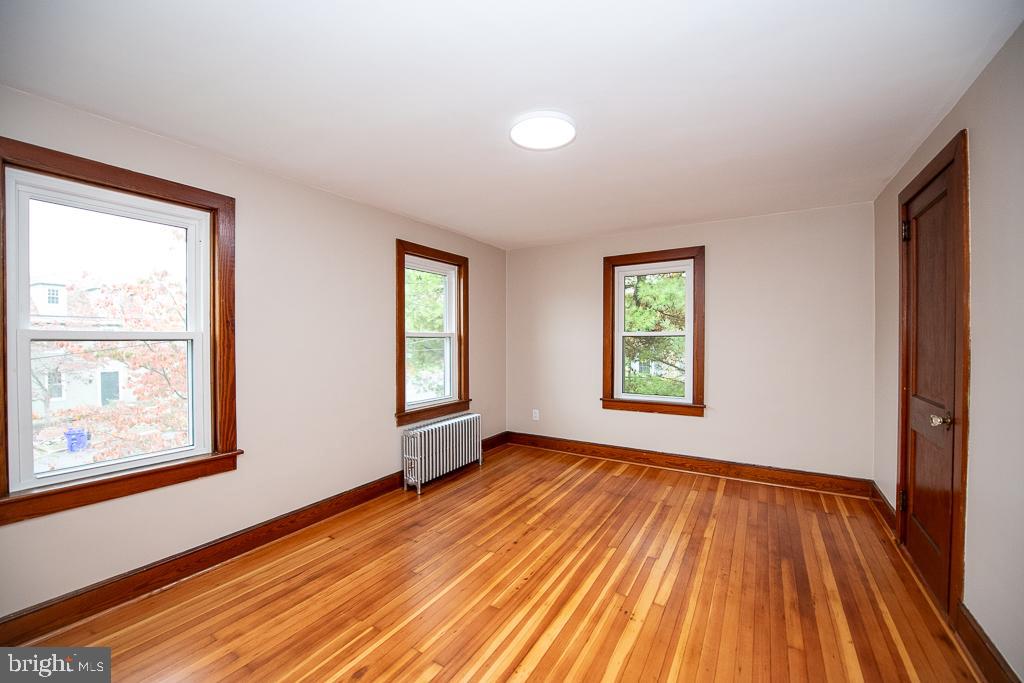 9 Fulton Avenue Walkersville, MD 21793 - Photo 20 of 28 a view of an empty room with wooden floor and a window