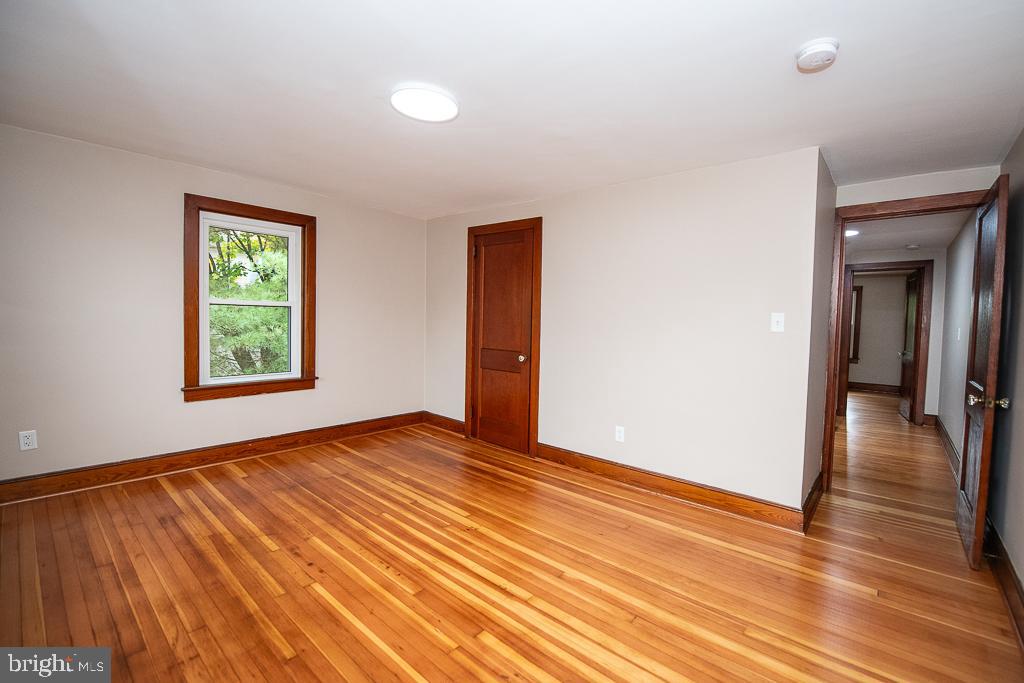 9 Fulton Avenue Walkersville, MD 21793 - Photo 21 of 28 wooden floor in an empty room with a window