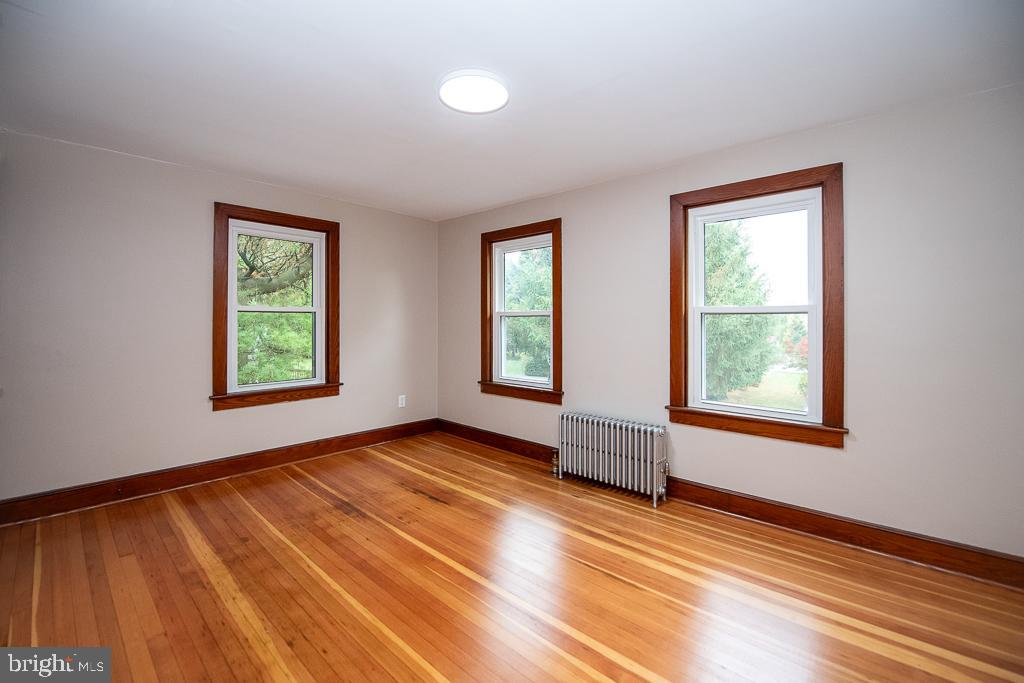 9 Fulton Avenue Walkersville, MD 21793 - Photo 24 of 28 a view of an empty room with window and wooden floor