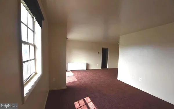 a view of a windows and an empty room