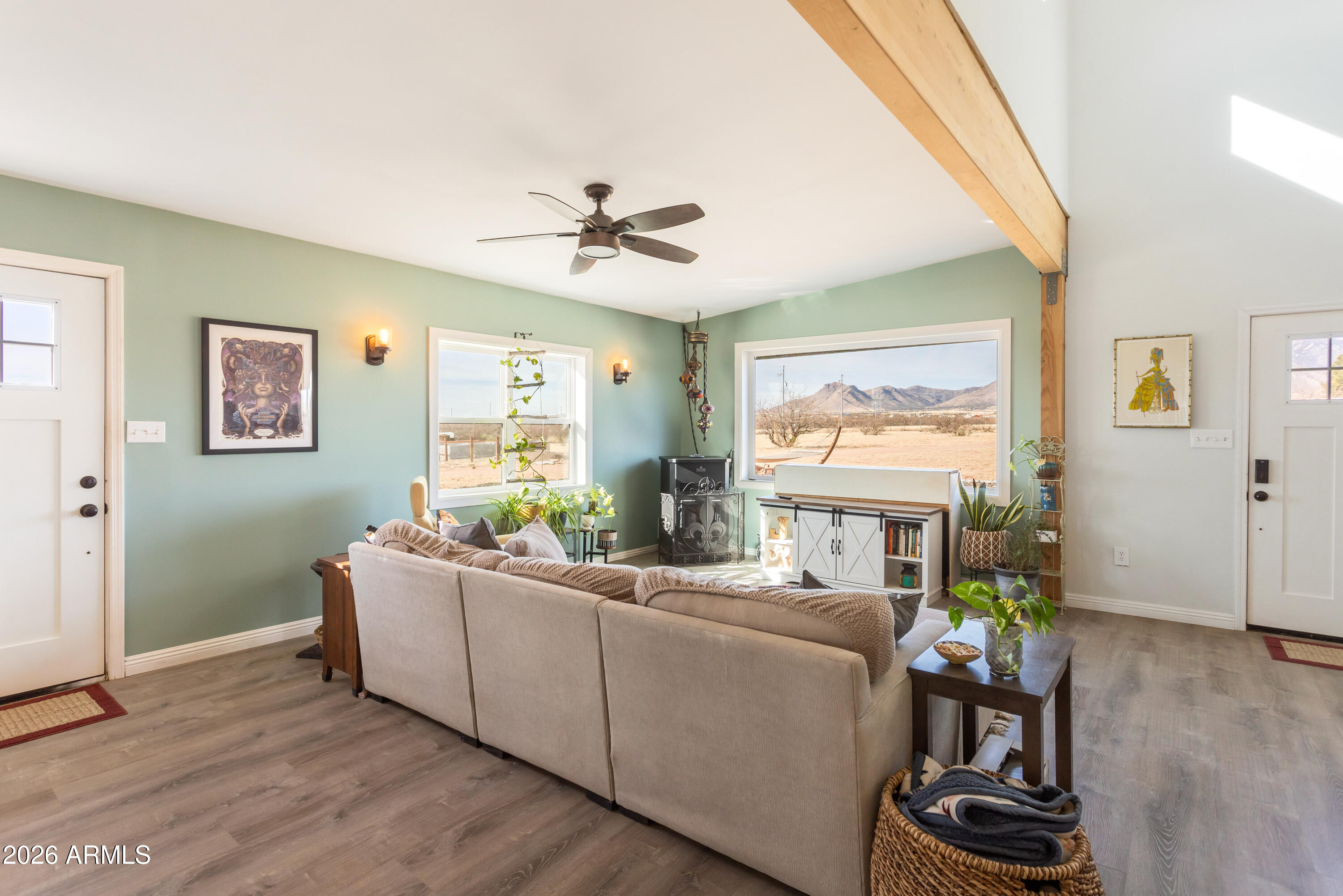 11441 South Samuel Road Hereford, AZ 85615 - Photo 23 of 47 a living room with furniture a chandelier and a window