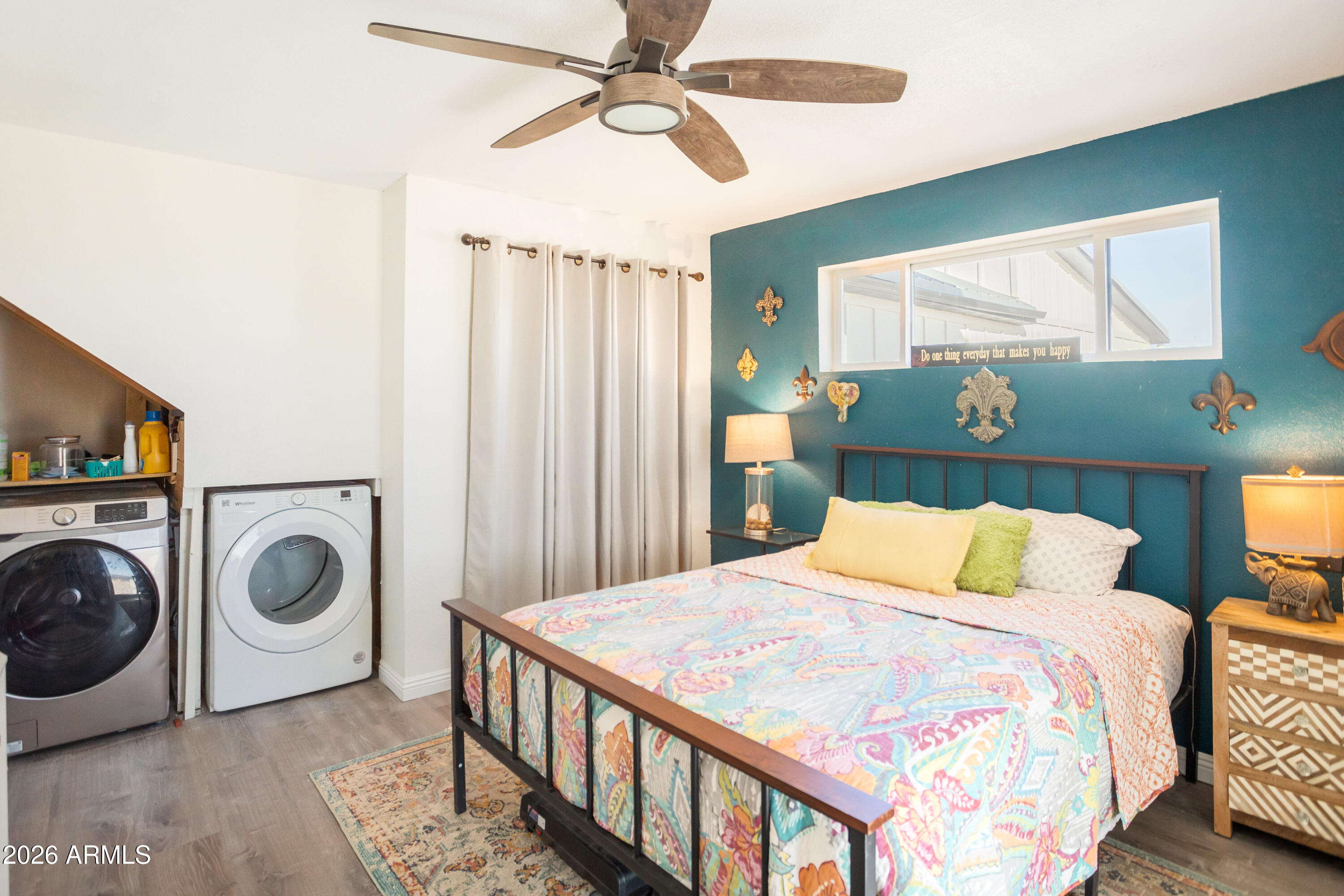 11441 South Samuel Road Hereford, AZ 85615 - Photo 37 of 47 a bedroom with a bed and a chandelier