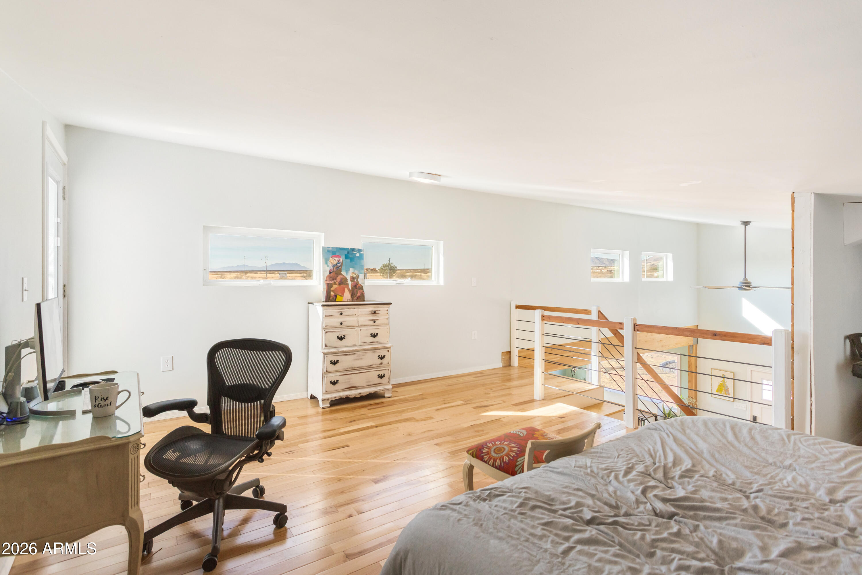 11441 South Samuel Road Hereford, AZ 85615 - Photo 40 of 47 a bedroom with furniture and a chair