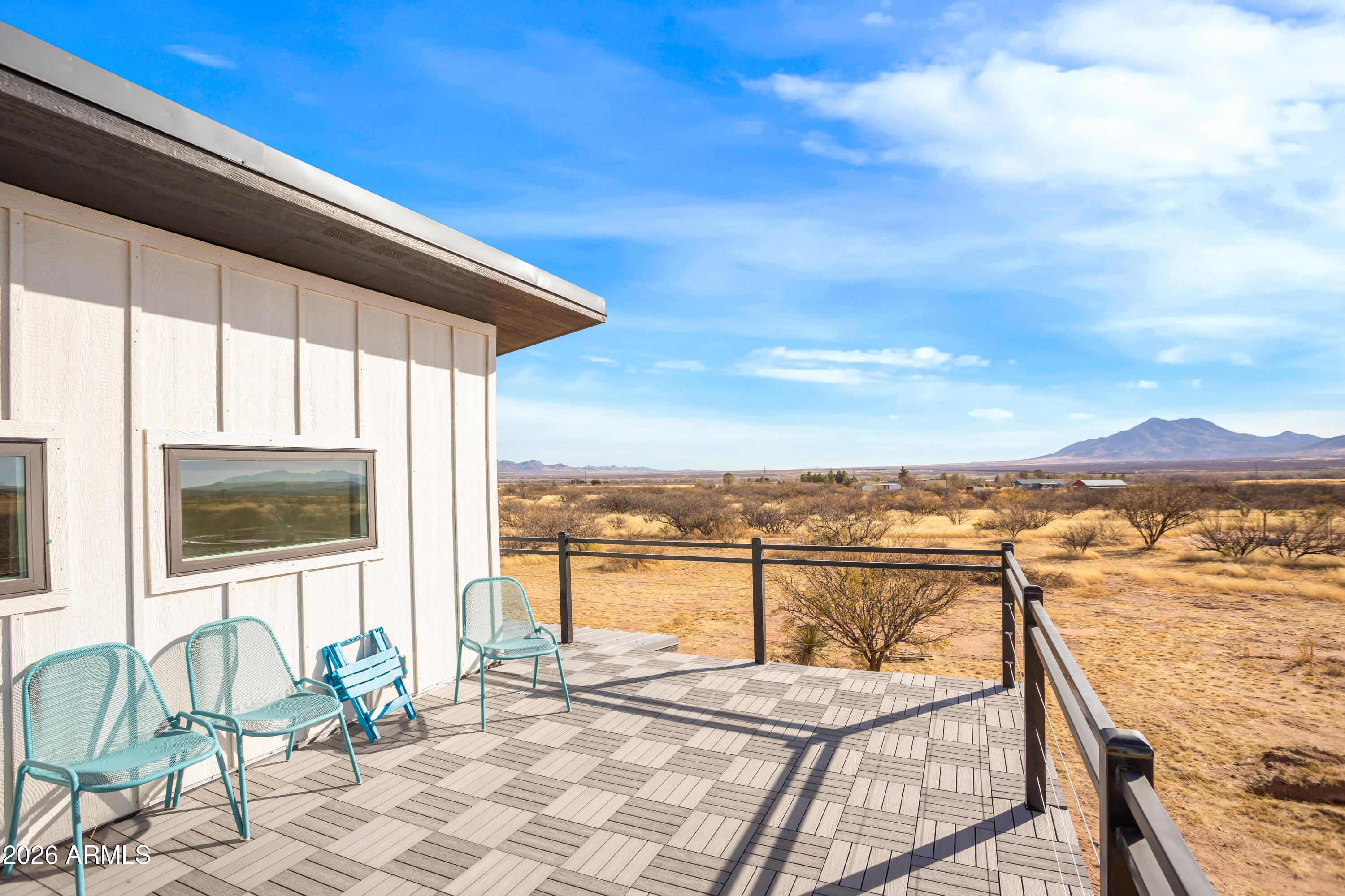 11441 South Samuel Road Hereford, AZ 85615 - Photo 43 of 47 a view of a balcony with chair and the ocean