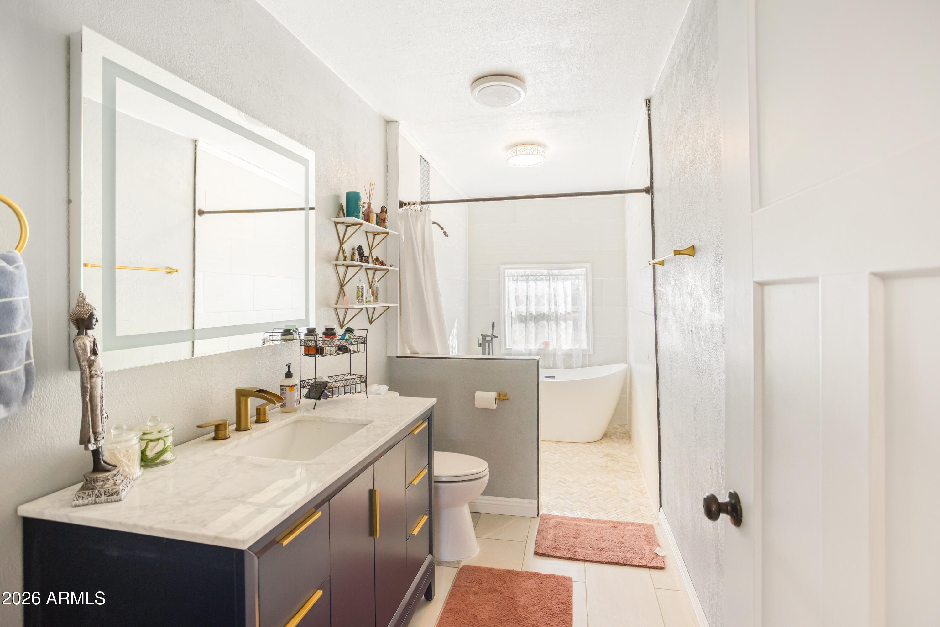 11441 South Samuel Road Hereford, AZ 85615 - Photo 7 of 47 a bathroom with a sink a toilet and shower