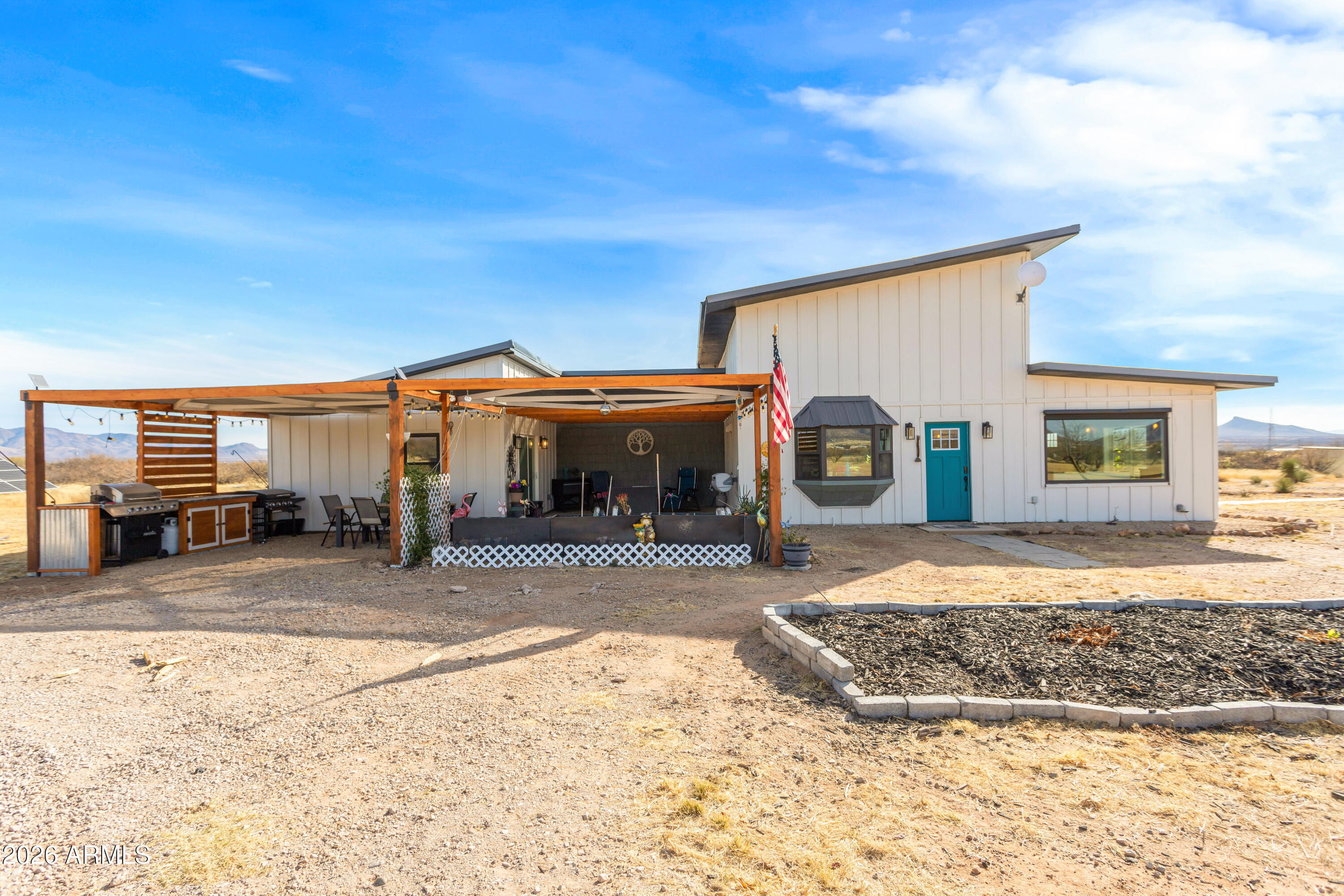 11441 South Samuel Road Hereford, AZ 85615 - Photo 10 of 47 a view of a house with a patio