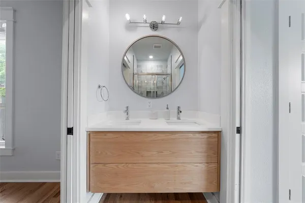 a bathroom with a sink and a mirror