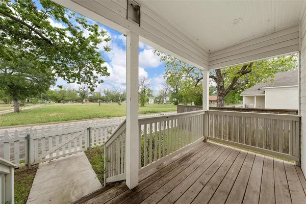 a view of balcony with wooden floor