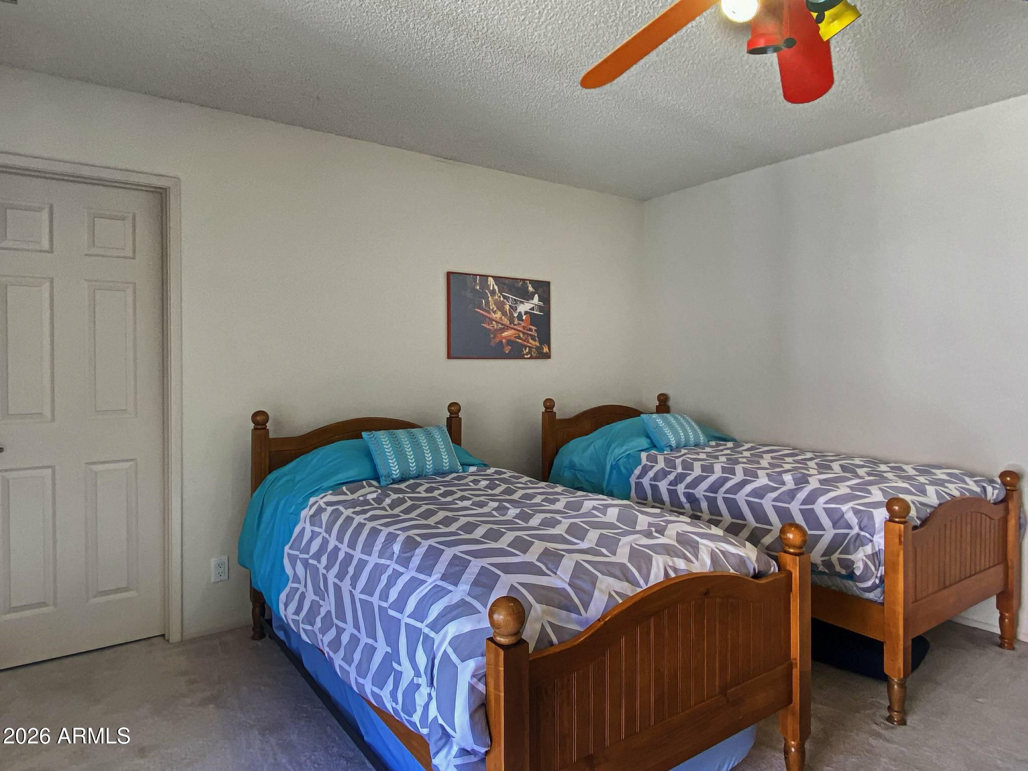 550 Barcelona Road Sedona, AZ 86336 - Photo 20 of 32 a bedroom with two beds and painted walls