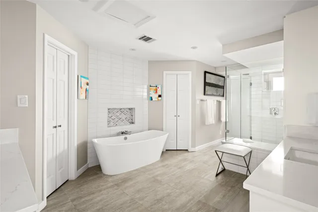 a bathroom with a double vanity sink and a mirror