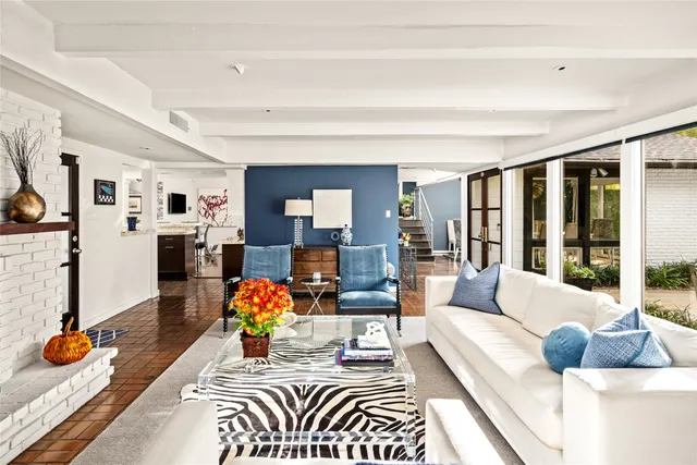 a building outdoor space with patio furniture and potted plants