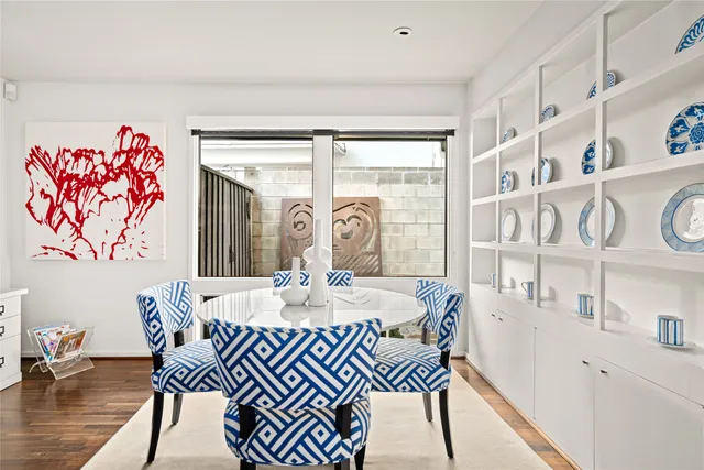 a living room with stainless steel appliances kitchen island granite countertop furniture and a view of kitchen