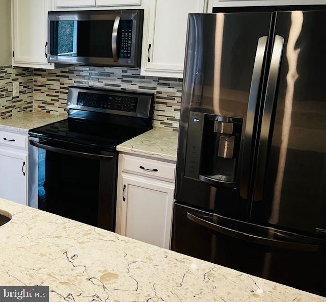 811 Deering Road, Unit 7F Pasadena, MD 21122 - Photo 3 of 19 Sleek modern kitchen with stylish finishes.