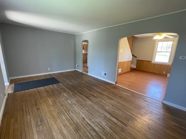 a view of an empty room with stairs