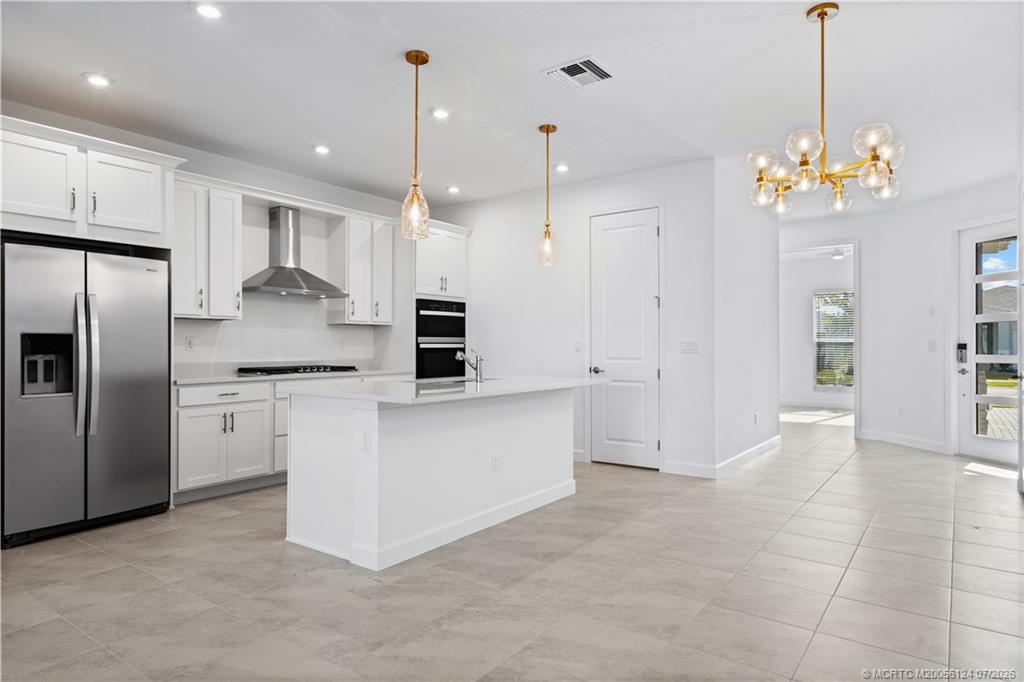9731 Southwest Indra Way Port St. Lucie, FL 34987 - Photo 6 of 33 Kitchen/ Living/ Dining