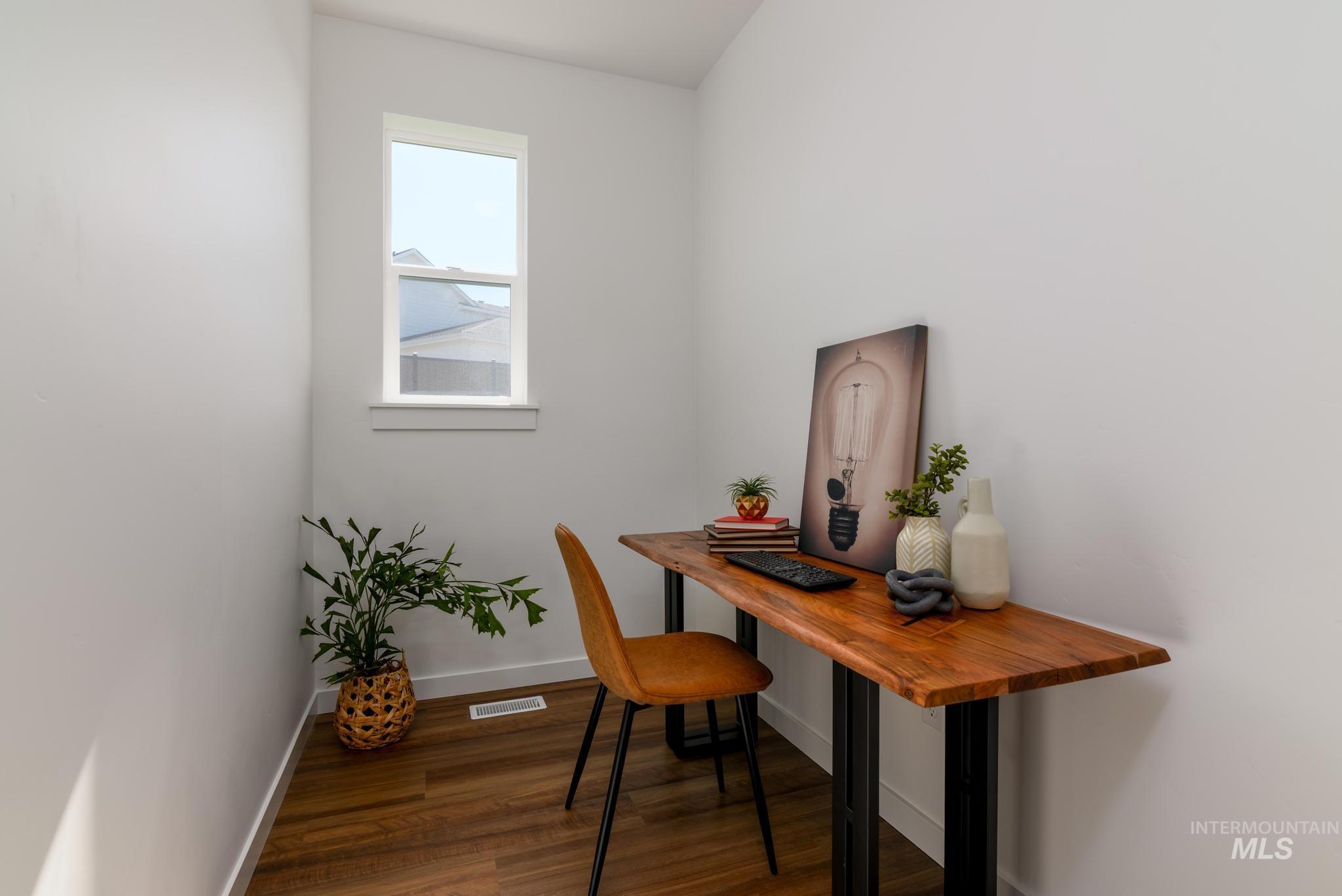 14829 Wing Spread Drive Caldwell, ID 83607 - Photo 6 of 10 Office featuring baseboards and dark wood finished floors