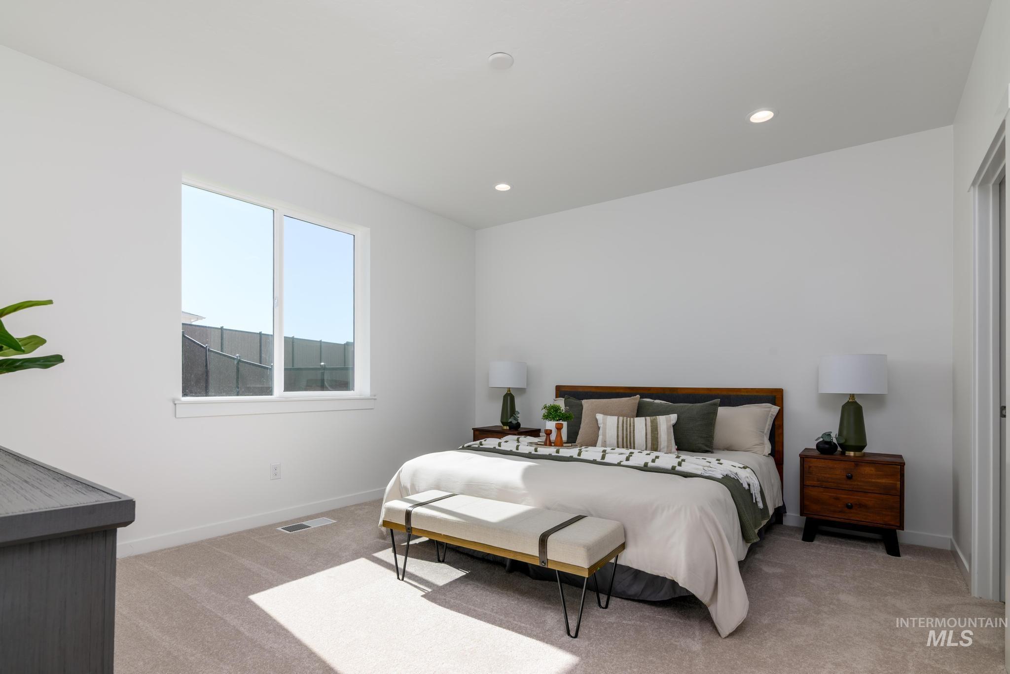 14829 Wing Spread Drive Caldwell, ID 83607 - Photo 7 of 10 Bedroom featuring light colored carpet and recessed lighting