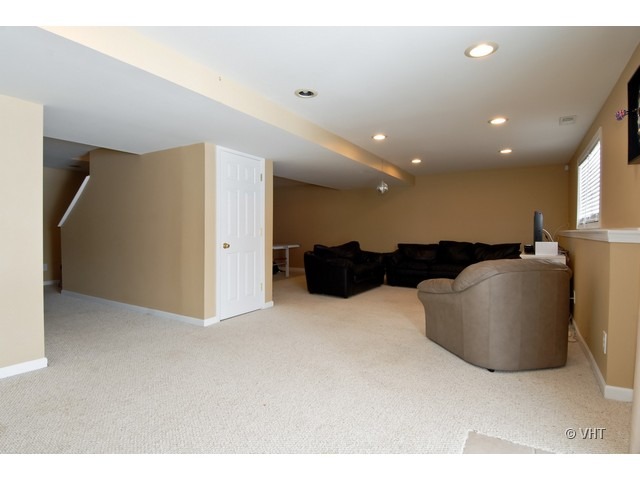 655 Ridge Drive Elburn, IL 60119 - Photo 8 of 16 a large room with large windows
