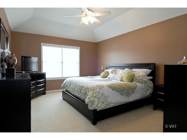 655 Ridge Drive Elburn, IL 60119 - Photo 9 of 16 a bedroom with a bed dresser and a window