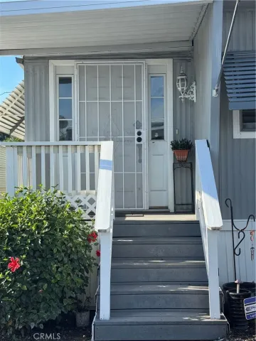 a view of staircase with wooden floor and a potted plant