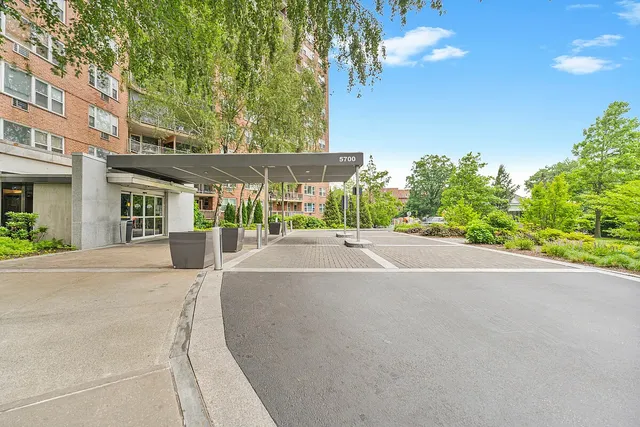a view of a house with a backyard and a garage