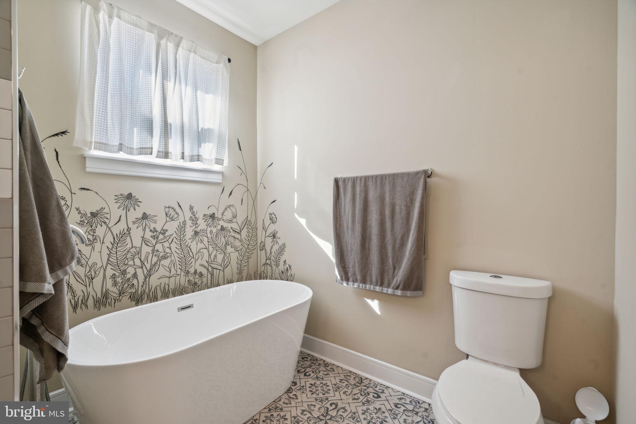 518 Mercy Street Philadelphia, PA 19148 - Photo 10 of 50 Serene bathroom with floral accents.