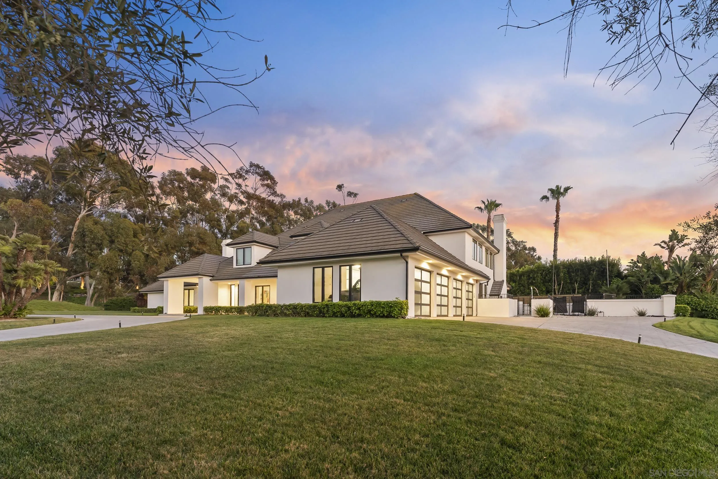 6850 Avenida De La Ronda Rancho Santa Fe, CA 92067 - Photo 35 of 40 a front view of a house with garden