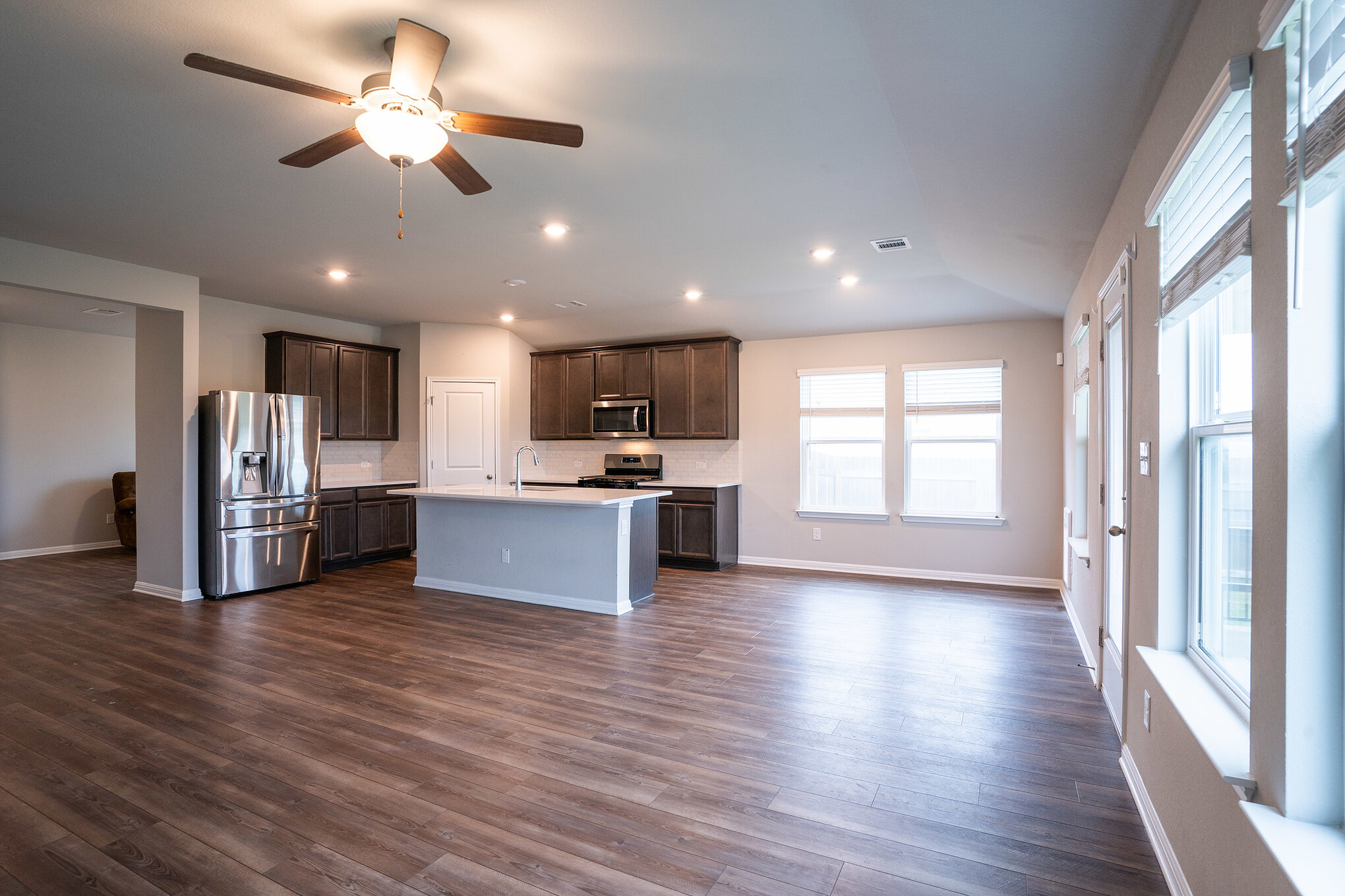 518 Windy Reed Road Hutto, TX 78634 - Photo 18 of 30 Plenty of light enters fro the back windows which overlook the peaceful green area.
