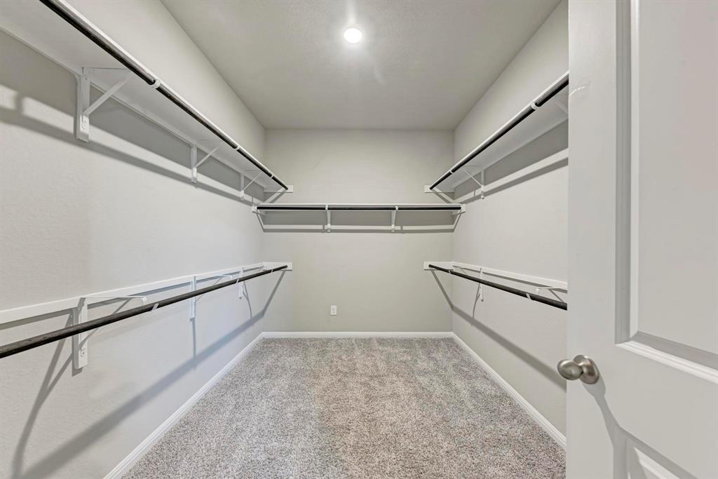 518 Windy Reed Road Hutto, TX 78634 - Photo 23 of 30 Spacious walk-in closet with plenty of space for him and her.