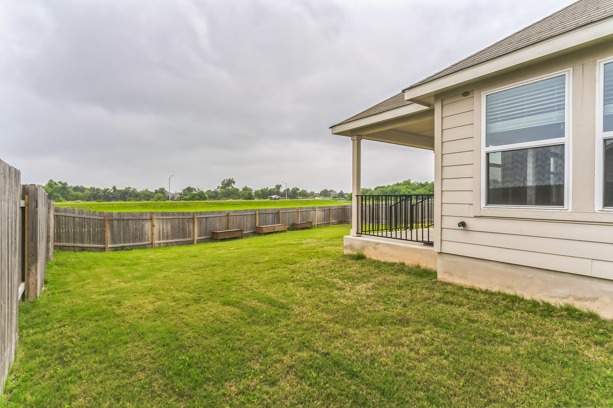 518 Windy Reed Road Hutto, TX 78634 - Photo 25 of 30 Fully fenced backyard with patio.