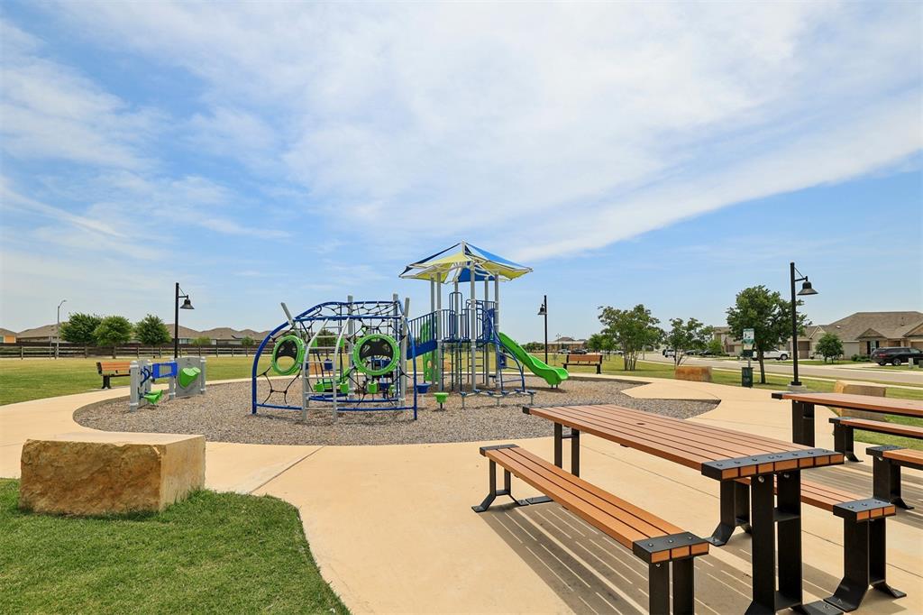 518 Windy Reed Road Hutto, TX 78634 - Photo 30 of 30 Cross creek features a community playground with picnic tables great for an afternoon of play.