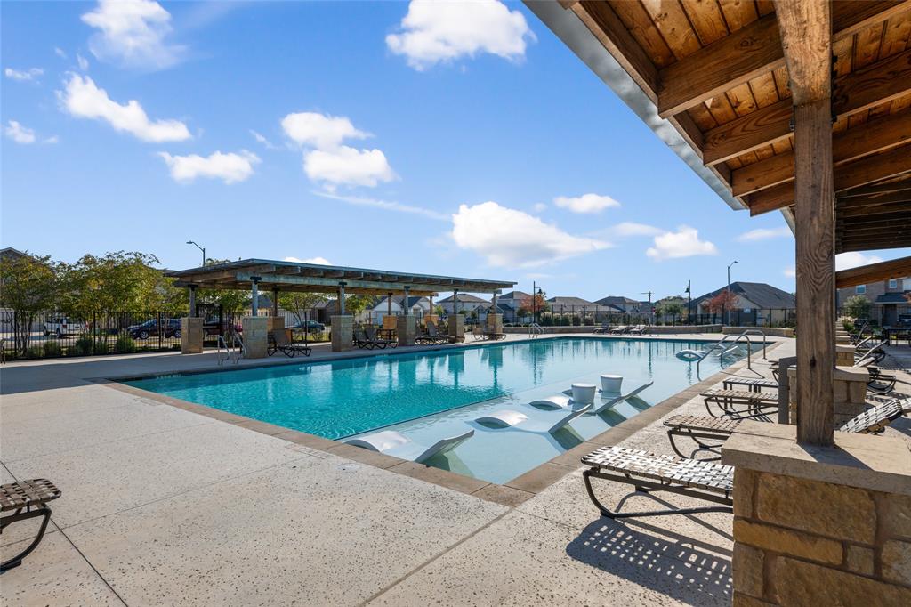 518 Windy Reed Road Hutto, TX 78634 - Photo 5 of 30 The community amenity center features a large pool, splash pad, large covered sitting areas and plenty of sunning chairs.