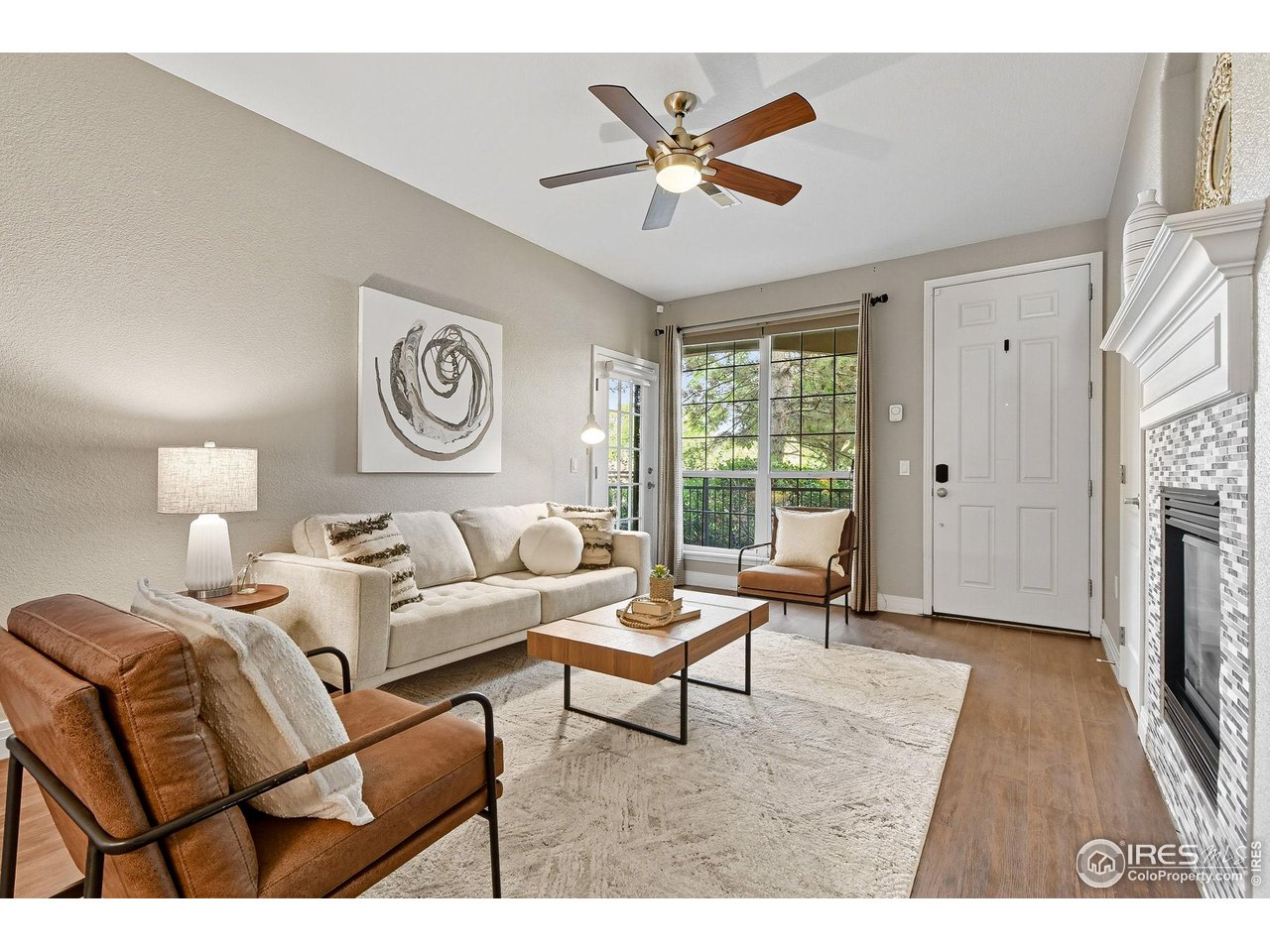 159 Quebec Street, Unit D Denver, CO 80220 - Photo 11 of 49 a living room with furniture a fireplace and a window