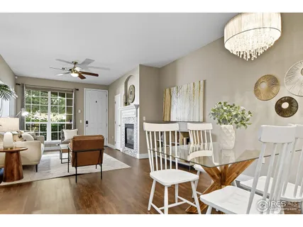 a view of livingroom and dining room with wooden floor