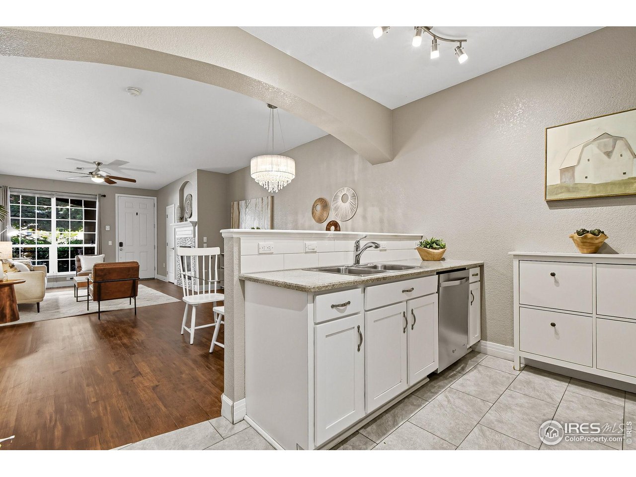 159 Quebec Street, Unit D Denver, CO 80220 - Photo 20 of 49 a kitchen with granite countertop a sink cabinets and wooden floor