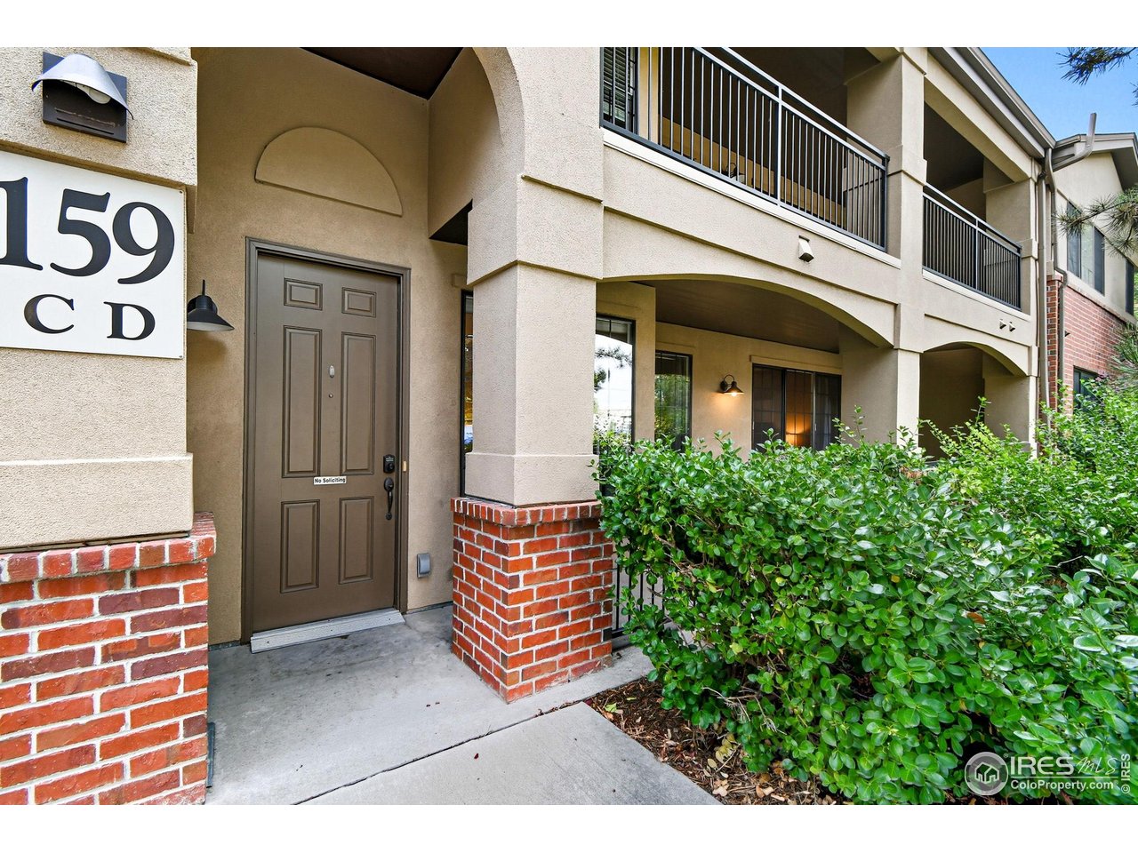 159 Quebec Street, Unit D Denver, CO 80220 - Photo 3 of 49 a front view of a building with garden