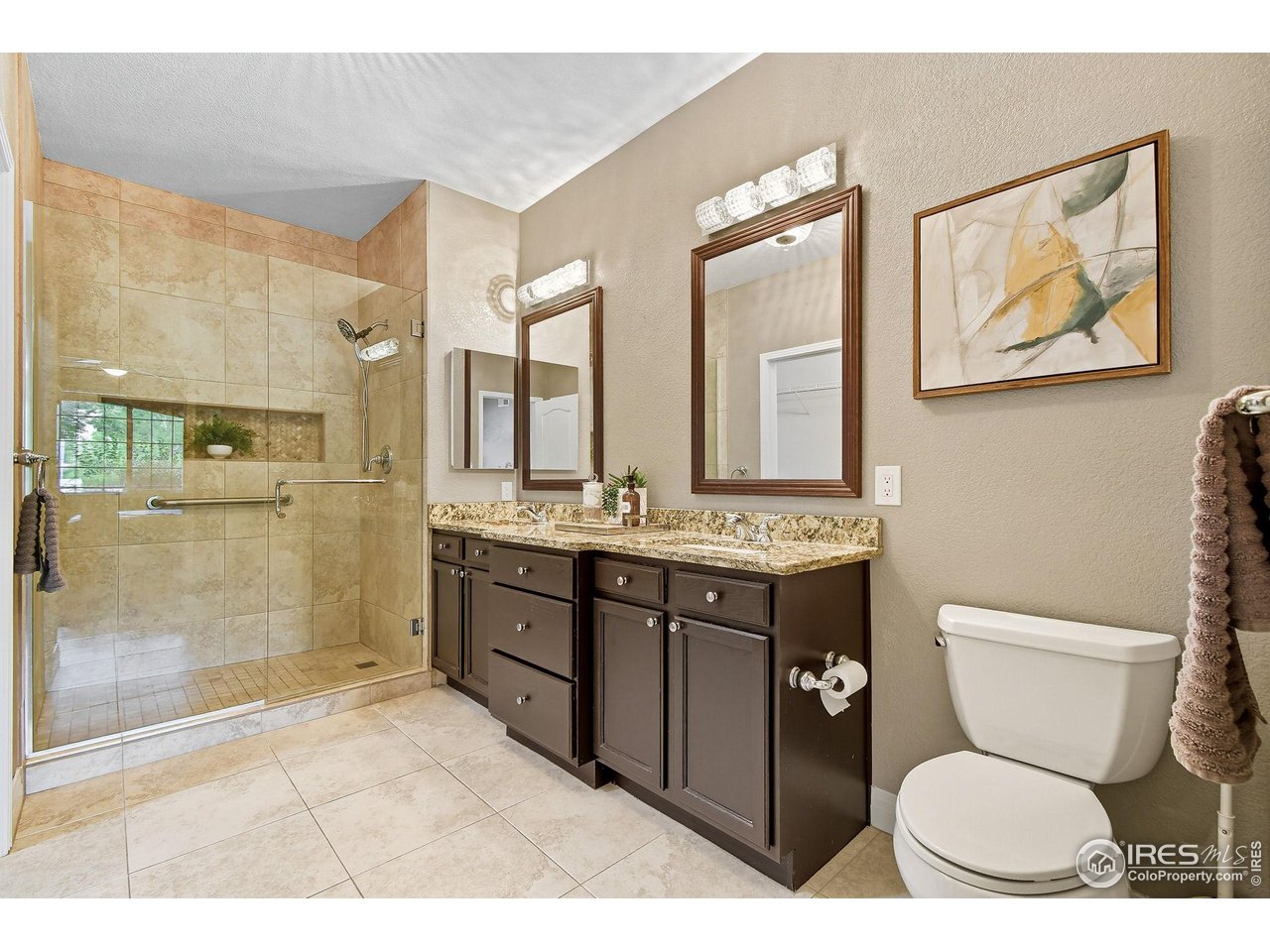 159 Quebec Street, Unit D Denver, CO 80220 - Photo 35 of 49 a bathroom with a toilet a sink and mirror