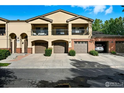 a front view of a house with garage