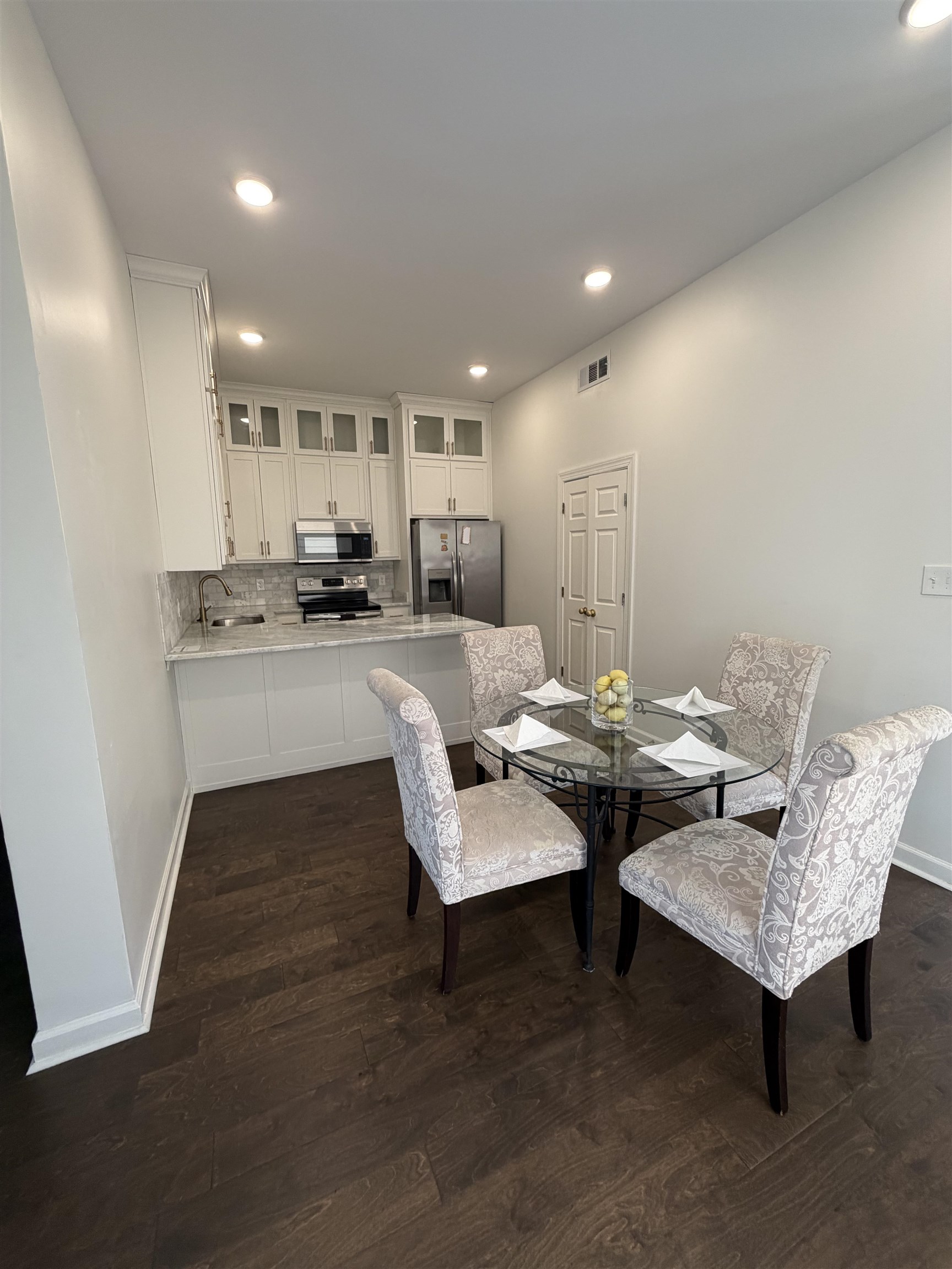 147 Greeff Lane Memphis, TN 38111 - Photo 11 of 23 a living room with kitchen island furniture and a wooden floor