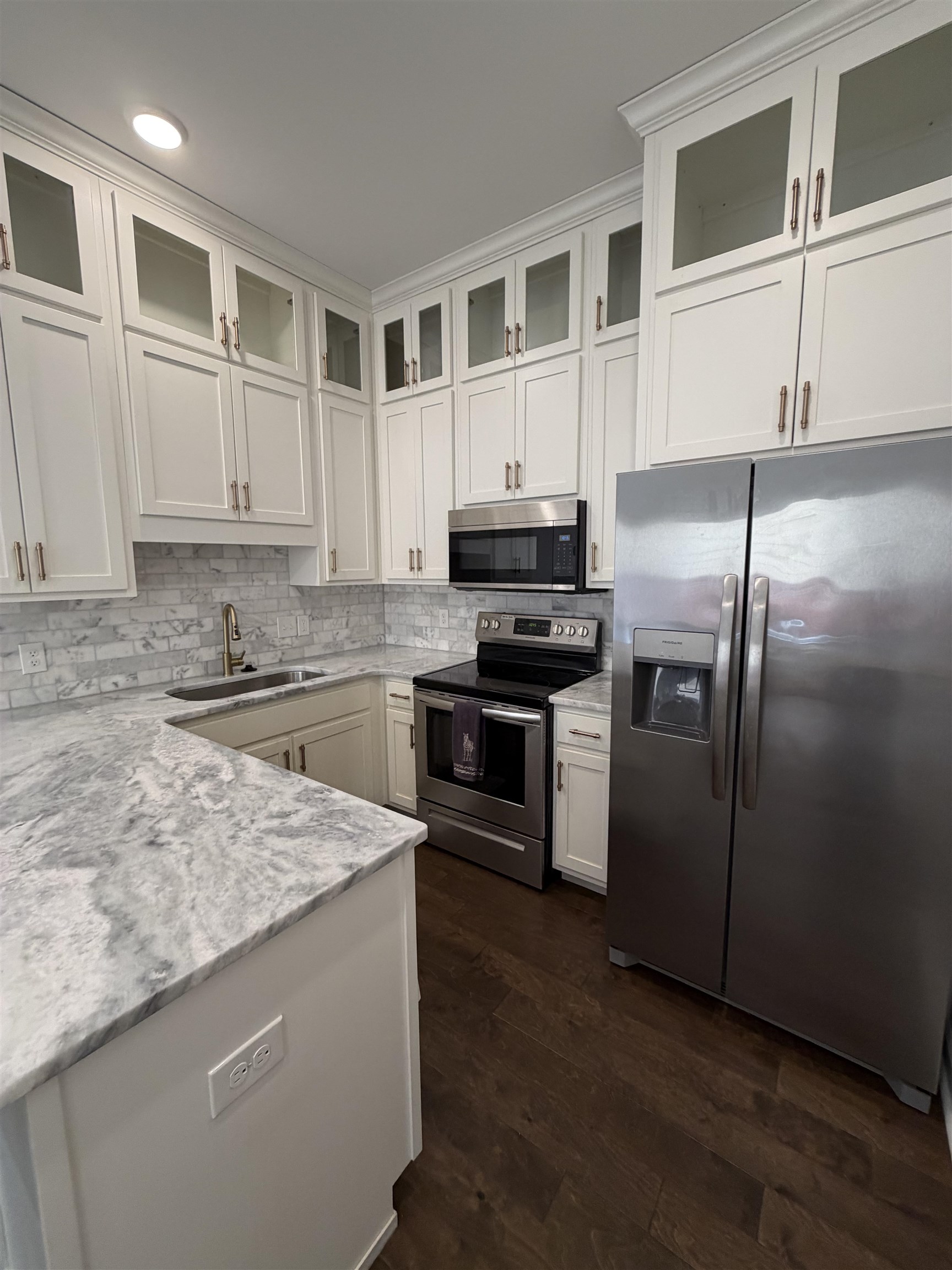 147 Greeff Lane Memphis, TN 38111 - Photo 14 of 23 a kitchen with stainless steel appliances granite countertop a stove a sink and a refrigerator