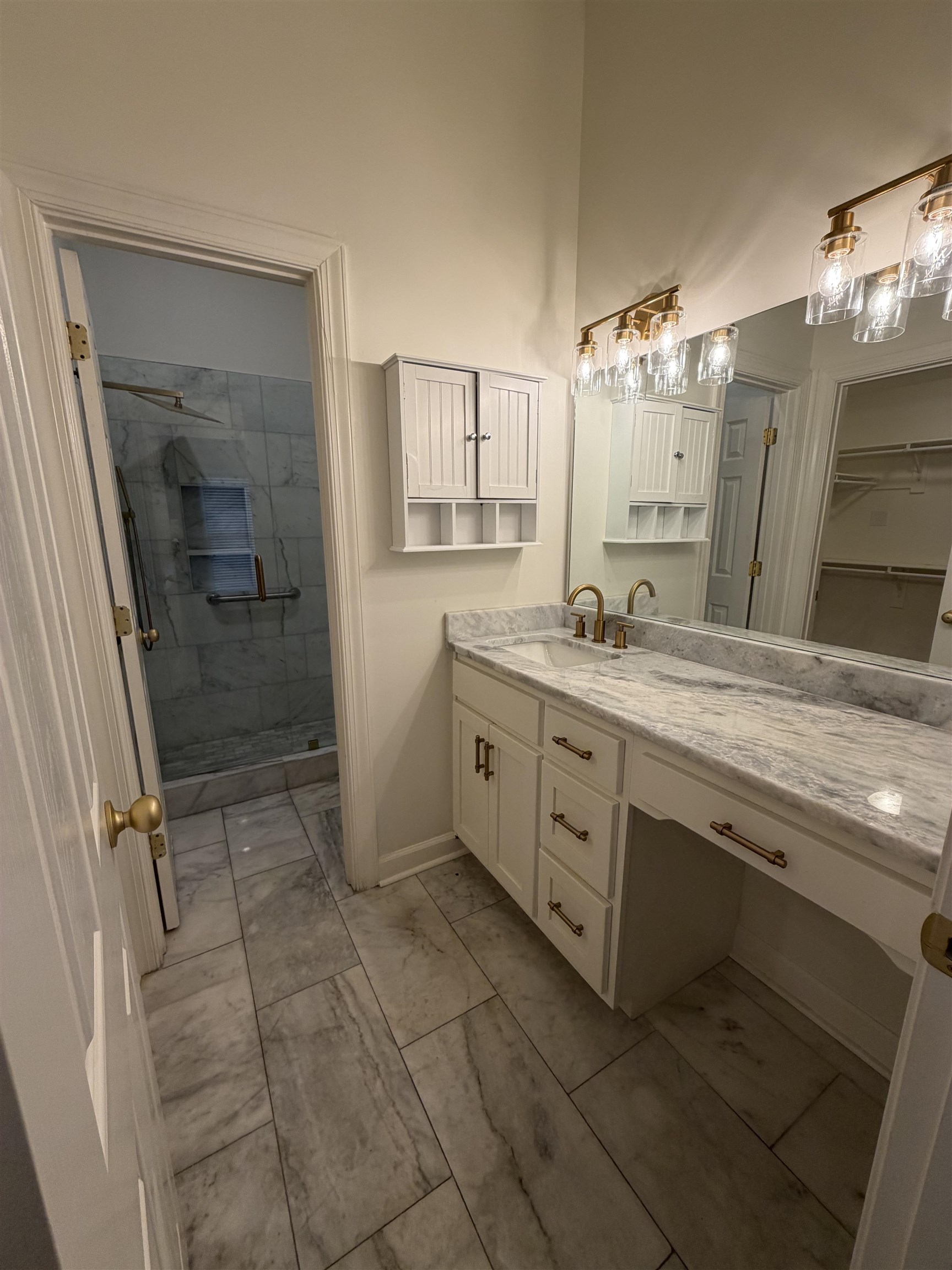 147 Greeff Lane Memphis, TN 38111 - Photo 16 of 23 a spacious bathroom with a granite countertop sink a mirror and a shower