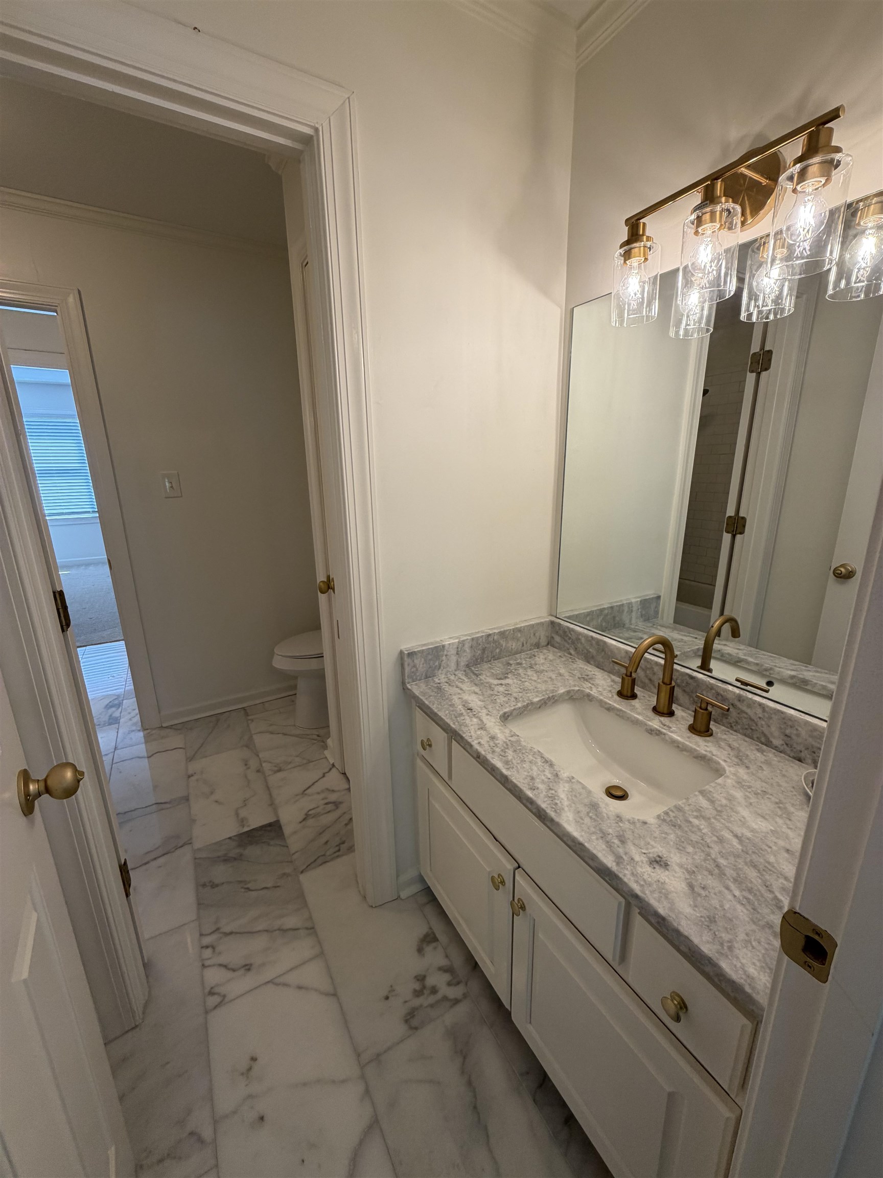 147 Greeff Lane Memphis, TN 38111 - Photo 20 of 23 a bathroom with a granite countertop sink and a mirror